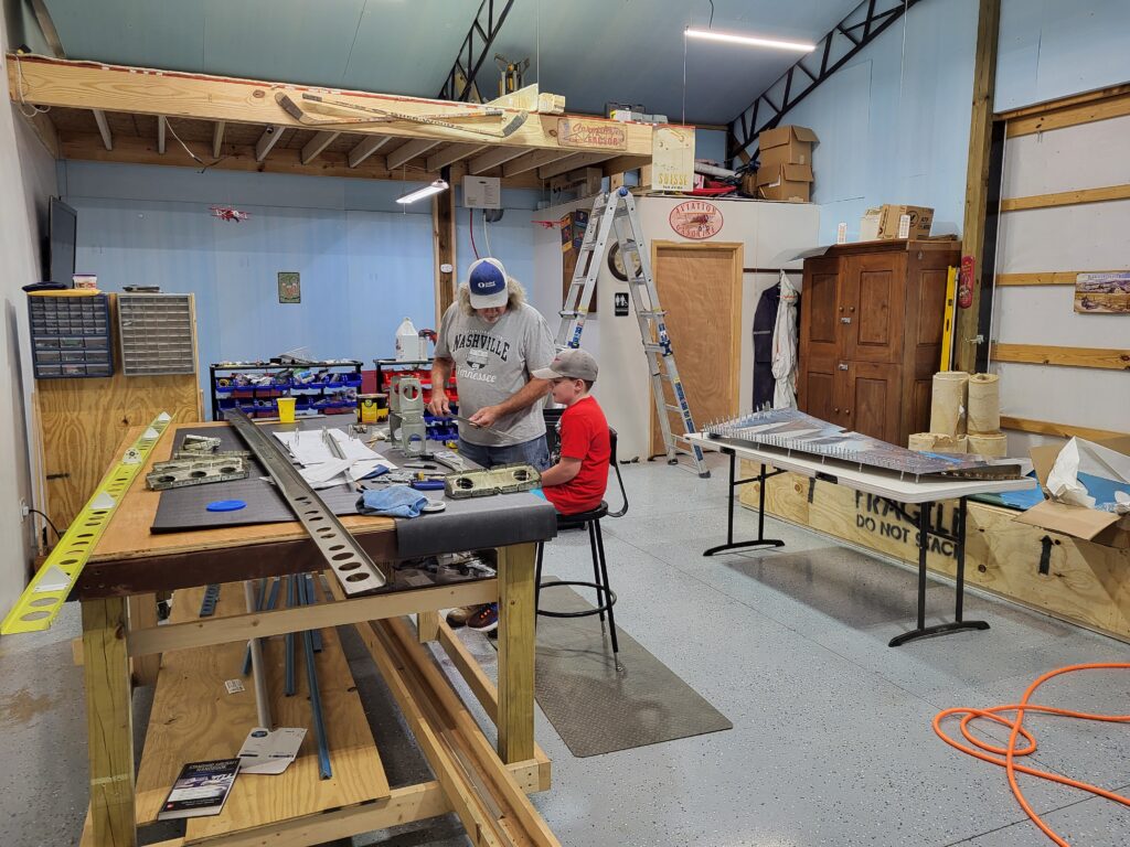 HS: Grandson's first airplane building lesson.